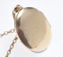 ENGRAVED 9 CT GOLD OVAL LOCKET ON A FINE 9 CT GOLD CHAIN at Ross's Online Art Auctions