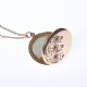 9 CARAT ROSE GOLD ENGRAVED CIRCULAR LOCKET ON A FINE 9 CARAT GOLD CHAIN at Ross's Online Art Auctions