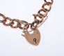9 CARAT ROSE GOLD BRACELET WITH A 9 CARAT GOLD HEART SHAPED PADLOCK CATCH at Ross's Online Art Auctions