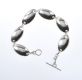 SILVER OVAL LINK BRACELET WITH A FITTED T BAR at Ross's Online Art Auctions