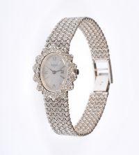 LADY'S 18 CARAT WHITE GOLD TAVERNIER WRIST WATCH WITH DIAMOND CLUSTER BEZEL at Ross's Online Art Auctions