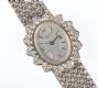 LADY'S 18 CARAT WHITE GOLD TAVERNIER WRIST WATCH WITH DIAMOND CLUSTER BEZEL at Ross's Online Art Auctions