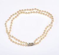 DOUBLE STRING OF CULTURED PEARLS WITH 9 CARAT WHITE GOLD DIAMOND MOUNTED CLASP at Ross's Online Art Auctions