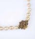 STRING OF CULTURED PEARLS WITH 9CT GOLD & GARNET CLASP at Ross's Online Art Auctions
