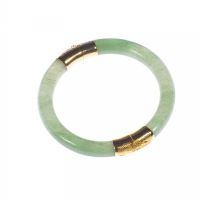 YELLOW METAL MOUNTED JADE BANGLE at Ross's Online Art Auctions