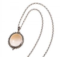 SILVER MOUNTED OVAL MOONSTONE PENDANT ON A SILVER BELCHER CHAIN at Ross's Online Art Auctions