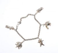 SILVER ANCHOR LINK CHARM BRACELET WITH ARTICULATED CHARMS at Ross's Online Art Auctions