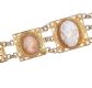 SILVER GILT FILIGREE NINE PANEL BRACELET WITH THREE SIMULATED CAMEO PANELS at Ross's Online Art Auctions
