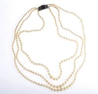 TRIPLE STRING OF GRADUATED CULTURED PEARLS WITH A SILVER ART DECO STYLE CLASP at Ross's Online Art Auctions