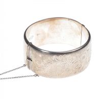 BROAD ENGRAVED SILVER BANGLE at Ross's Online Art Auctions