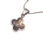 SILVER MOTHER OF PEARL FLOWER PENDANT ON A SILVER SNAKE CHAIN at Ross's Online Art Auctions
