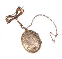 GOLD PLATED ENGRAVED LOCKET ON A 14 CT GOLD BOW BROOCH at Ross's Online Art Auctions