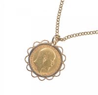 HALF SOVEREIGN IN A 9 CT GOLD MOUNT ON A 9 CT GOLD ROLO LINK CHAIN at Ross's Online Art Auctions