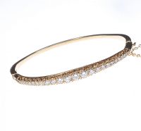 9 CT GOLD GRADUATED DIAMOND BANGLE at Ross's Online Art Auctions