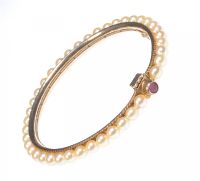 GOLD CULTURED PEARL BANGLE WITH RUBY CLASP at Ross's Online Art Auctions
