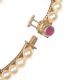 GOLD CULTURED PEARL BANGLE WITH RUBY CLASP at Ross's Online Art Auctions