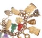 VICTORIAN 9 CT GOLD CHARM BRACELET WITH HEART SHAPED PADLOCK CATCH & SIXTEEN IVORY, CORAL, JADE & GOLD CHARMS at Ross's Online Art Auctions