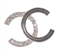 CLASSICAL DIAMANTE AND ENAMEL BROOCH IN THE MANNER OF CHANEL at Ross's Online Art Auctions