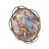 OVAL PORCELAIN BROOCH IN GILT METAL MOUNT at Ross's Online Art Auctions