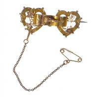 9 CT GOLD BOW BROOCH at Ross's Online Art Auctions