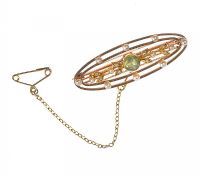 15 CT PIERCED GOLD PERIDOT AND SEED PEARL BROOCH at Ross's Online Art Auctions