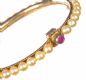 GOLD PLATE AND CULTURED PEARL BANGLE WITH RUBY CLASP at Ross's Online Art Auctions
