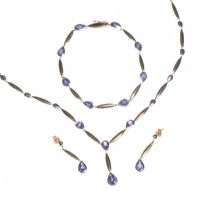 A SUITE OF 9CT GOLD AND TANZANITE NECKLACE, BRACELET AND EARRINGS at Ross's Online Art Auctions