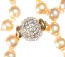 STRING OF CHAMPAGNE GLASS PEARLS WITH DIAMANT CLASP at Ross's Online Art Auctions