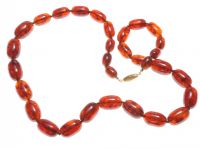 AMBER COLOURED RESIN BEAD NECKLACE WITH GOLD PLATED CLASP at Ross's Online Art Auctions
