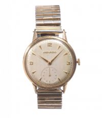 MOVADO GENT'S WRIST WATCH WITH 9CT GOLD CASE AND GOLD PLATED BRACELET at Ross's Online Art Auctions