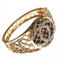 METAL AND DIAMANT BANGLE IN THE STYLE OF CHANEL at Ross's Online Art Auctions