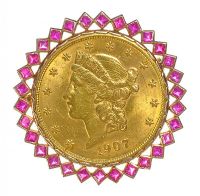 TWENTY DOLLAR COIN IN A DECORATIVE 9CT GOLD BROOCH MOUNT WITH PINK GEMSTONES at Ross's Online Art Auctions