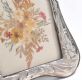 STERLING SILVER PHOTO FRAME IN A DAFFODIL DESIGN WITH PRESSED FLOWERS at Ross's Online Art Auctions