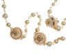 GOLD-COLOURED METAL FAUX PEARL AND KNITTED WOOL NECKLACE IN THE STYLE OF CHANEL at Ross's Online Art Auctions