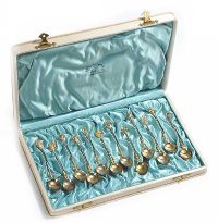 SET OF TWELVE ITALIAN SILVER GILT COFFEE SPOONS IN A SILK LINED DISPLAY BOX ENCLOSING A GIFT CARD SIGNED VICTORIA MARY CHRISTMAS 1904 at Ross's Online Art Auctions
