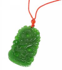 CARVED JADE PENDANT AND CORD at Ross's Online Art Auctions