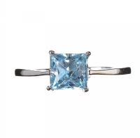 RHODIUM-PLATED BRASS AND BLUE TOPAZ SOLITAIRE RING at Ross's Online Art Auctions