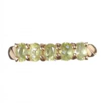 9CT GOLD RING SET WITH FIVE PERIDOTS IN A CLAW SETTING at Ross's Online Art Auctions