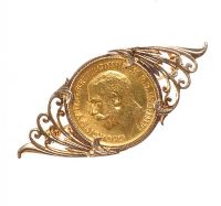 HALF-SOVEREIGN MOUNTED IN A 9CT GOLD BROOCH at Ross's Online Art Auctions