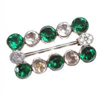 ENGRAVED SILVER BROOCH SET WITH GREEN AND COLOURLESS CRYSTALS at Ross's Online Art Auctions