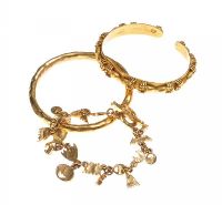 A TRIO OF GOLD-COLOURED METAL BANGLES AND A BRACELET at Ross's Online Art Auctions