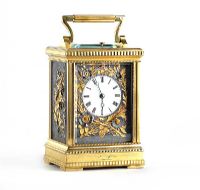 20TH CENTURY FRENCH BRASS CASED REPEATING CARRIAGE CLOCK WITH EMBOSSED BRASS SIDE PANELS AND A SWING HANDLE at Ross's Online Art Auctions