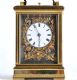 20TH CENTURY FRENCH BRASS CASED REPEATING CARRIAGE CLOCK WITH EMBOSSED BRASS SIDE PANELS AND A SWING HANDLE at Ross's Online Art Auctions