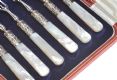 A SET OF SIX BOXED SILVER-PLATED DESSERT FORKS WITH MOTHER-OF-PEARL HANDLES at Ross's Online Art Auctions