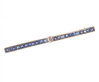 EDWARDIAN 18CT GOLD BAR BROOCH SET WITH SAPPHIRES AND A DIAMOND at Ross's Online Art Auctions