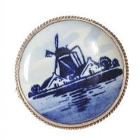 ENGRAVED SILVER ROUND BROOCH WITH PAINTED PORCELAIN PANEL IN A LOW-COUNTRY THEME at Ross's Online Art Auctions