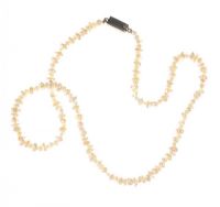 STRAND OF FRESHWATER PEARLS WITH A SILVER-TONE METAL CLASP at Ross's Online Art Auctions