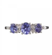 STERLING SILVER AND TANZANITE THREE STONE RING at Ross's Online Art Auctions