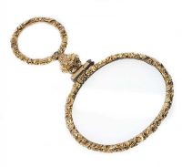OVAL MAGNIFYING GLASS FRAMED IN GILT METAL at Ross's Online Art Auctions