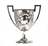 IMPORTANT EMBOSSED SILVER TWO HANDLE TROPHY CUP at Ross's Online Art Auctions